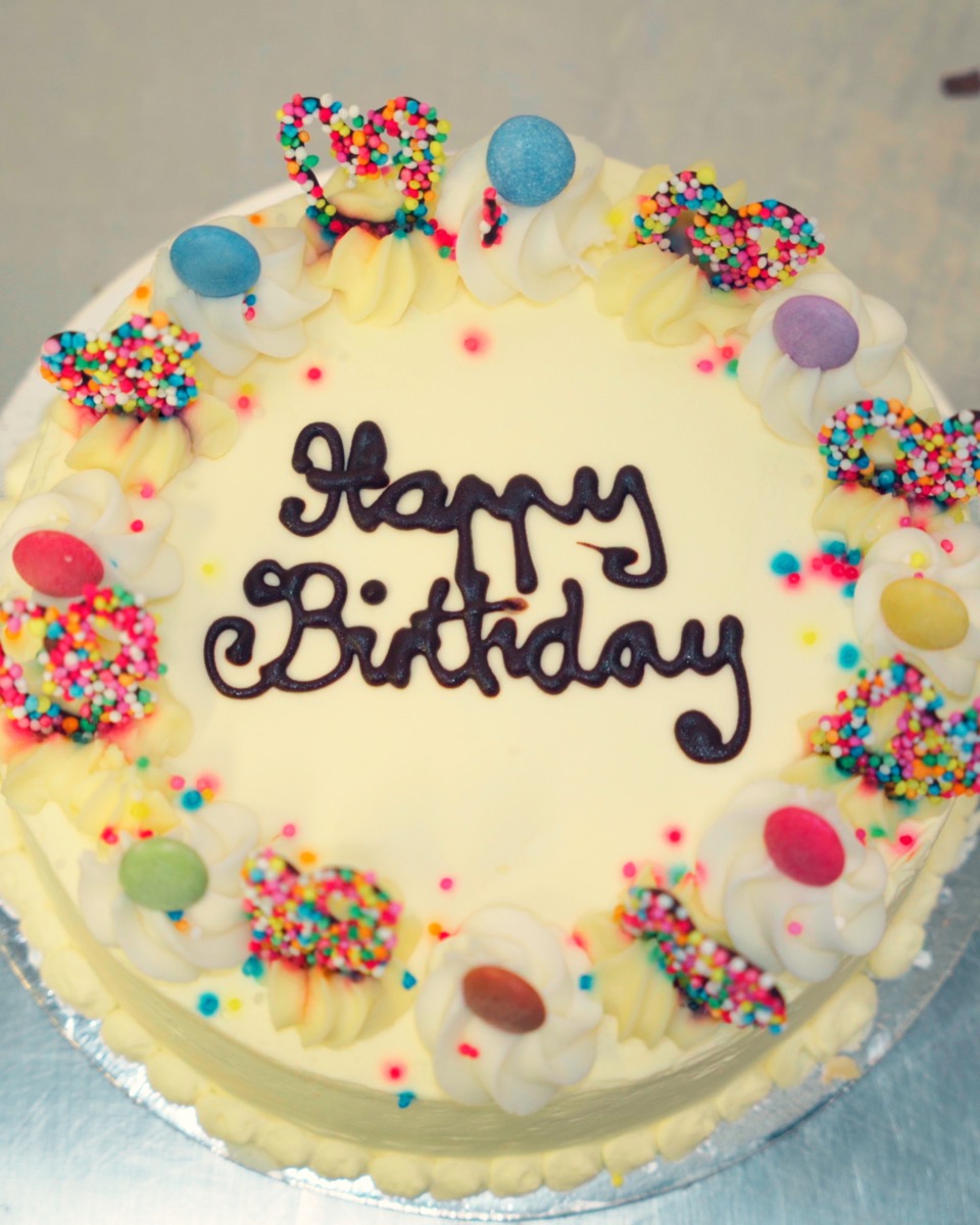 White celebration cake with sprinkles